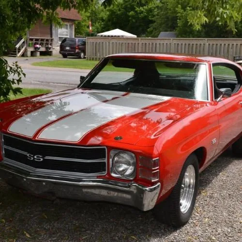 A red Chevelle SS with white racing stripes